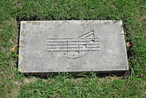 Opening notes of Fanfare for the Common Man carved in stone in memory of Aaron Copland at Tanglewood. (Photo: Natalie Maynor)
